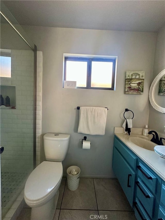 813 Cortez Dr, Hemet, CA 92545 - bathroom with tile patterned floors, vanity, and a tile shower