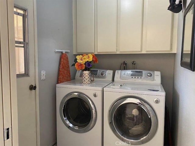 813 Cortez Dr, Hemet, CA 92545 - laundry room featuring independent washer and dryer and cabinet space