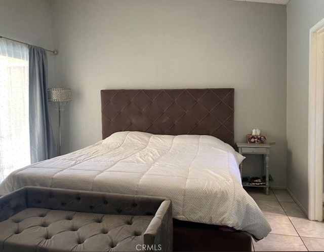 813 Cortez Dr, Hemet, CA 92545 - bedroom featuring multiple windows and light tile patterned flooring