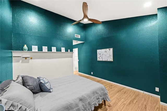 1696 Shady Brook Dr Unit 14, Fullerton, CA 92831 - bedroom with a towering ceiling, wood finished floors, ceiling fan, and a textured wall