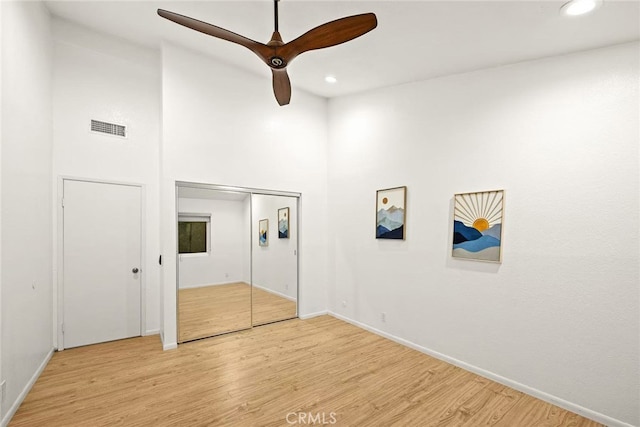 1696 Shady Brook Dr Unit 14, Fullerton, CA 92831 - unfurnished bedroom with wood finished floors, recessed lighting, a towering ceiling, and a ceiling fan