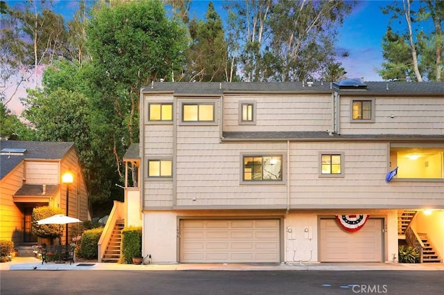 1696 Shady Brook Dr Unit 14, Fullerton, CA 92831 - view of property featuring stairs and an attached garage