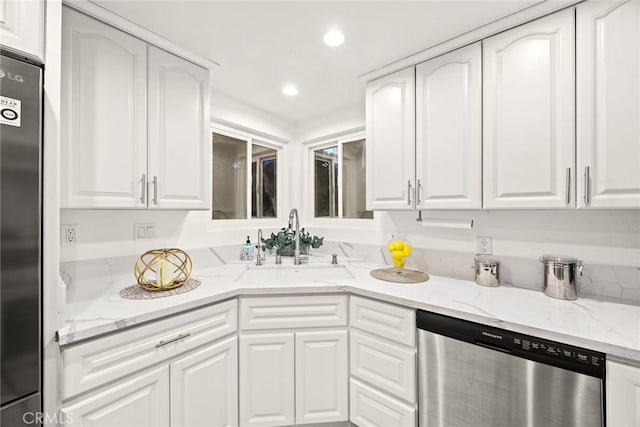 1696 Shady Brook Dr Unit 14, Fullerton, CA 92831 - kitchen featuring appliances with stainless steel finishes, white cabinetry, recessed lighting, and light stone counters