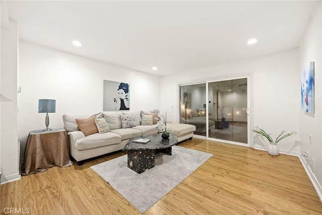 1696 Shady Brook Dr Unit 14, Fullerton, CA 92831 - living room with light wood-style flooring and recessed lighting