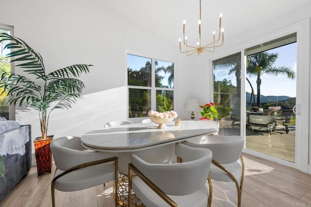 2027 Jenna Pl, Escondido, CA 92029 - dining space featuring a chandelier, light wood-style floors, and vaulted ceiling