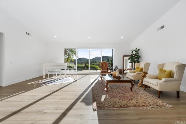 2027 Jenna Pl, Escondido, CA 92029 - living area featuring lofted ceiling, wood finished floors, recessed lighting, and a mountain view