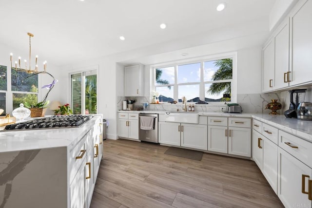 2027 Jenna Pl, Escondido, CA 92029 - kitchen featuring stainless steel appliances, recessed lighting, decorative backsplash, white cabinetry, and a chandelier