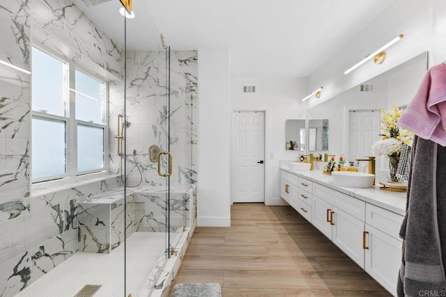 2027 Jenna Pl, Escondido, CA 92029 - bathroom featuring a marble finish shower, double vanity, and wood finished floors
