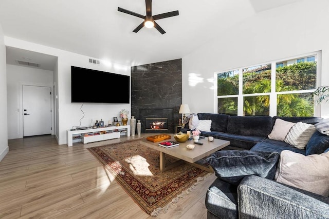 2027 Jenna Pl, Escondido, CA 92029 - living room featuring a ceiling fan, light wood-style flooring, a fireplace, and lofted ceiling