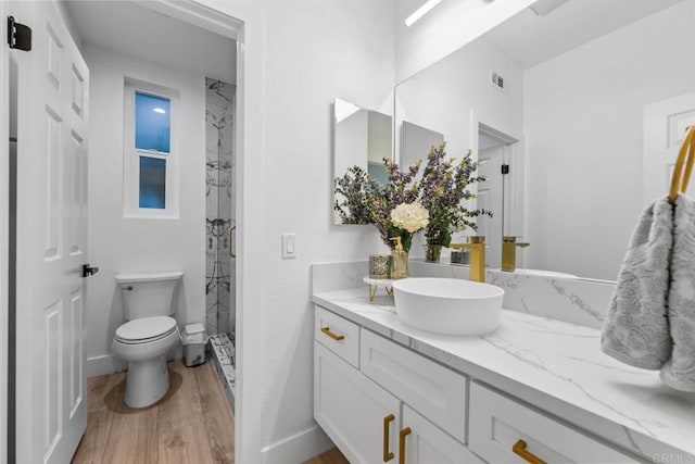 2027 Jenna Pl, Escondido, CA 92029 - full bathroom with a marble finish shower, vanity, and wood finished floors