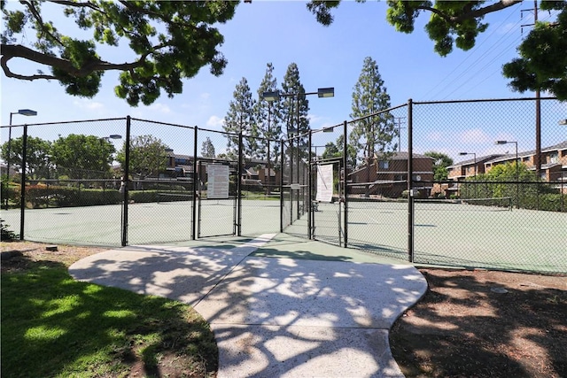 13135 Sunnybrook Cir Unit 205, Garden Grove, CA 92844 - view of tennis court featuring a gate
