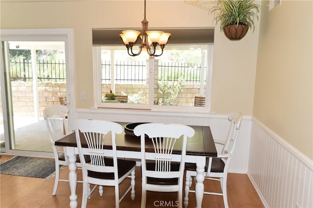 20611 Alaminos Dr, Saugus, CA 91350 - dining room with a chandelier, plenty of natural light, a wainscoted wall, and wood finished floors