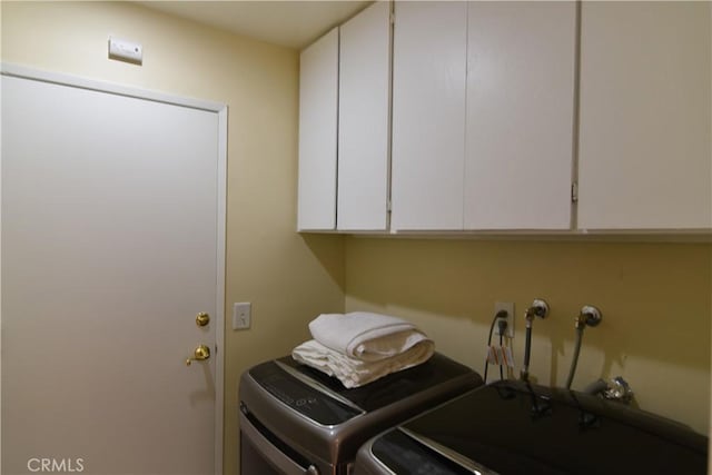 20611 Alaminos Dr, Saugus, CA 91350 - laundry room with washer and clothes dryer and cabinet space