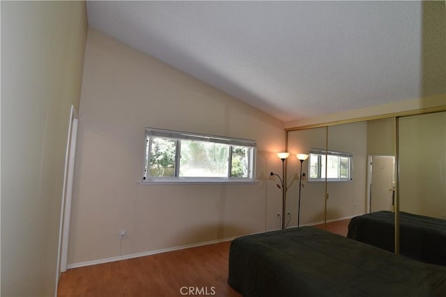 20611 Alaminos Dr, Saugus, CA 91350 - bedroom featuring lofted ceiling, wood finished floors, and a closet
