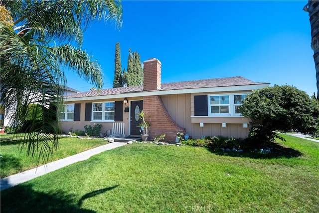 3730 E Euclid Ave, Orange, CA 92869 - single story home with a chimney, a front yard, and board and batten siding