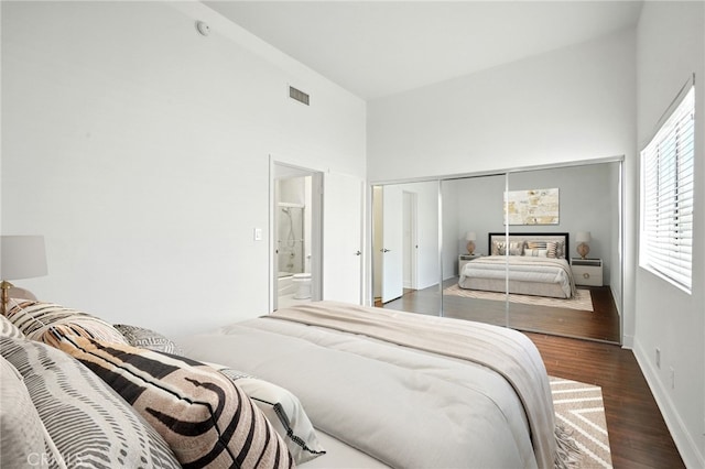 12001 Goshen Ave Unit 303, Los Angeles, CA 90049 - bedroom with a high ceiling, wood finished floors, a closet, and ensuite bath