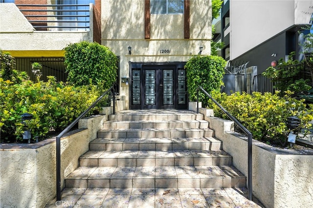 12001 Goshen Ave Unit 303, Los Angeles, CA 90049 - property entrance with french doors and stucco siding