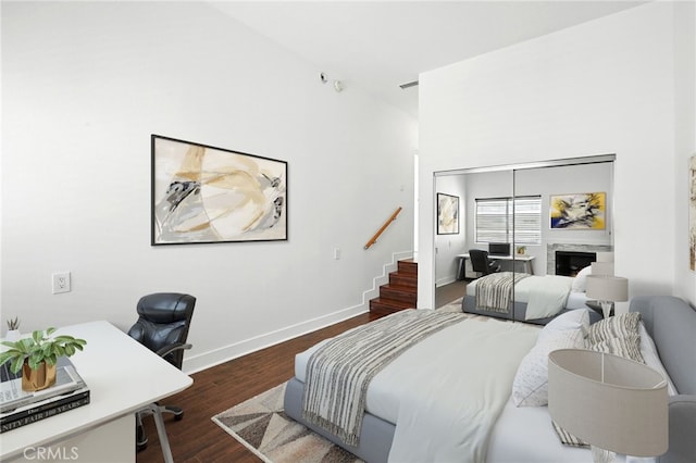 12001 Goshen Ave Unit 303, Los Angeles, CA 90049 - bedroom with wood finished floors, a desk, and a fireplace