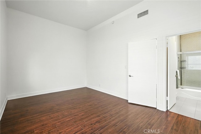 12001 Goshen Ave Unit 303, Los Angeles, CA 90049 - unfurnished bedroom featuring wood finished floors and ensuite bathroom