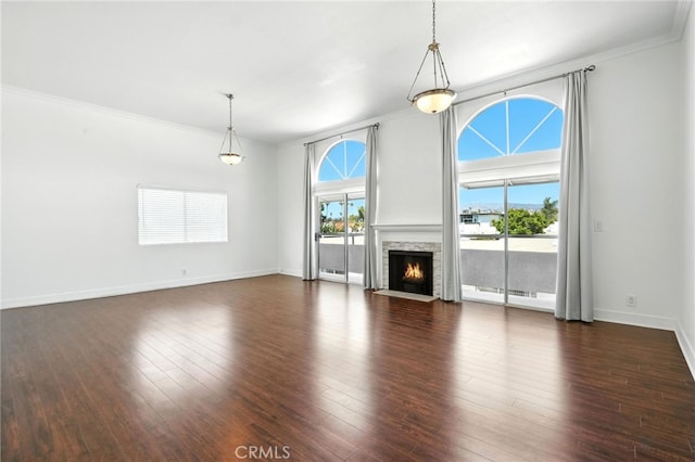 12001 Goshen Ave Unit 303, Los Angeles, CA 90049 - unfurnished living room featuring ornamental molding, dark wood-type flooring, and a stone fireplace