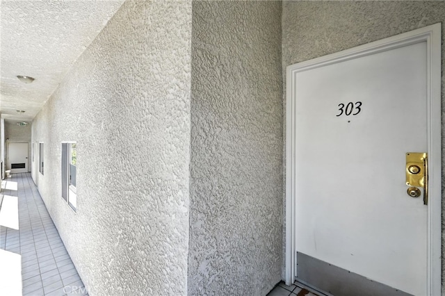 12001 Goshen Ave Unit 303, Los Angeles, CA 90049 - doorway to property with stucco siding
