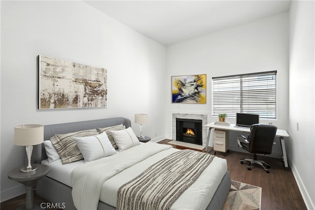 12001 Goshen Ave Unit 303, Los Angeles, CA 90049 - bedroom with wood finished floors, a fireplace with flush hearth, and an office area