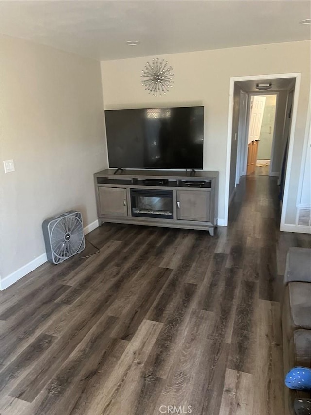 26447 Paseo Carmel Unit 11D, San Juan Capistrano, CA 92675 - living area with dark wood-style floors