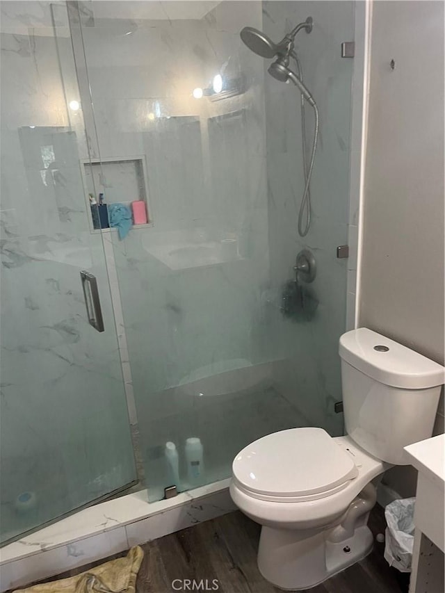 26447 Paseo Carmel Unit 11D, San Juan Capistrano, CA 92675 - full bathroom featuring a stall shower, vanity, and wood finished floors