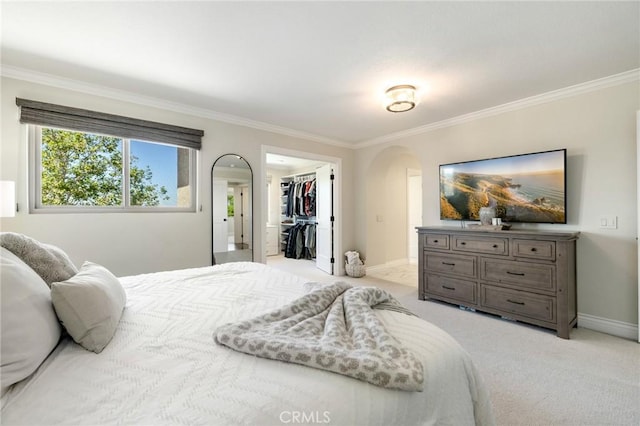 2666 Peacock Pl, La Verne, CA 91750 - bedroom featuring arched walkways, crown molding, light carpet, and a walk in closet