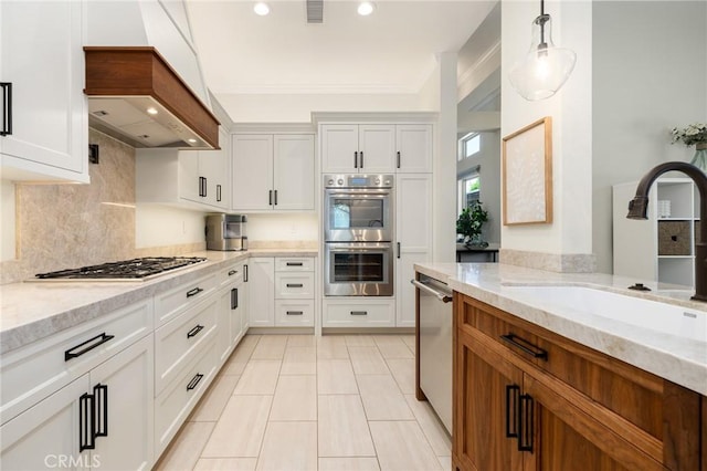 2666 Peacock Pl, La Verne, CA 91750 - kitchen featuring appliances with stainless steel finishes, light stone counters, recessed lighting, custom exhaust hood, and decorative backsplash