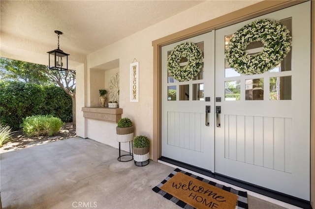 2666 Peacock Pl, La Verne, CA 91750 - view of exterior entry featuring french doors and stucco siding