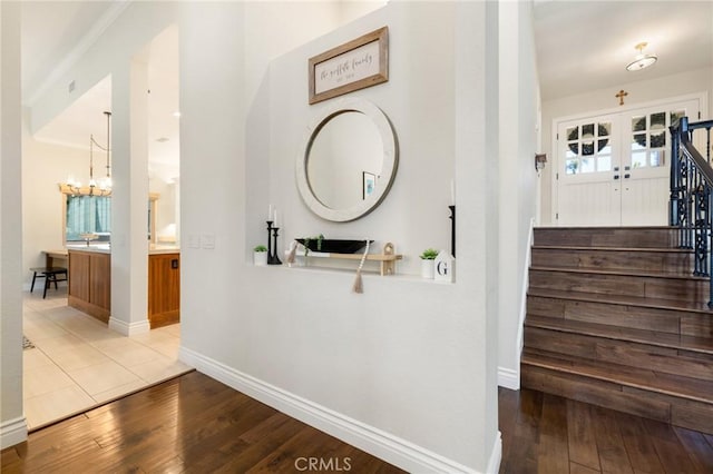 2666 Peacock Pl, La Verne, CA 91750 - hall featuring wood-type flooring, a chandelier, and stairway