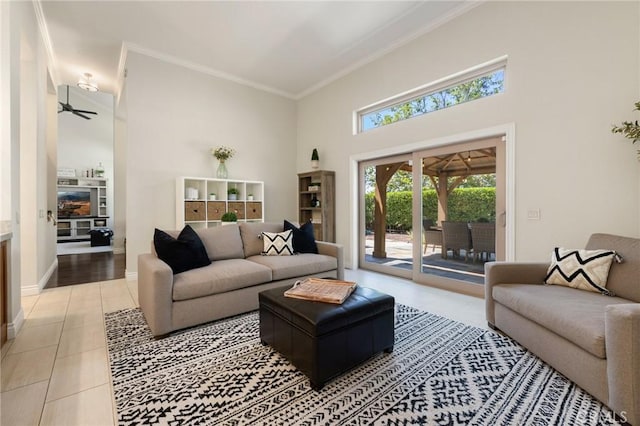 2666 Peacock Pl, La Verne, CA 91750 - living area with light tile patterned floors, plenty of natural light, crown molding, a high ceiling, and a ceiling fan