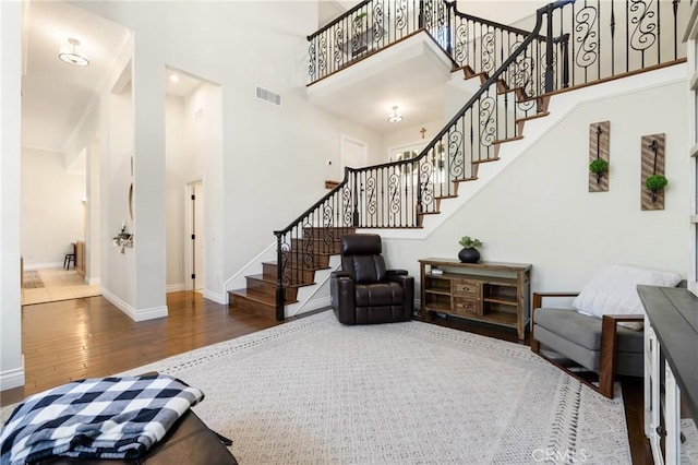 2666 Peacock Pl, La Verne, CA 91750 - living area with a towering ceiling, wood finished floors, and stairs