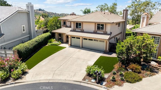 2666 Peacock Pl, La Verne, CA 91750 - view of front of property with a garage, concrete driveway, stucco siding, a tiled roof, and a chimney