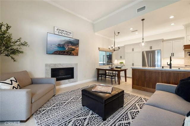 2666 Peacock Pl, La Verne, CA 91750 - living room with ornamental molding, a high end fireplace, a chandelier, and recessed lighting