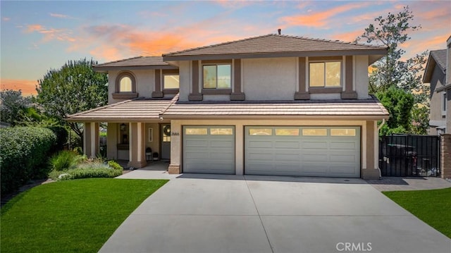 2666 Peacock Pl, La Verne, CA 91750 - view of front facade featuring a garage, driveway, and stucco siding