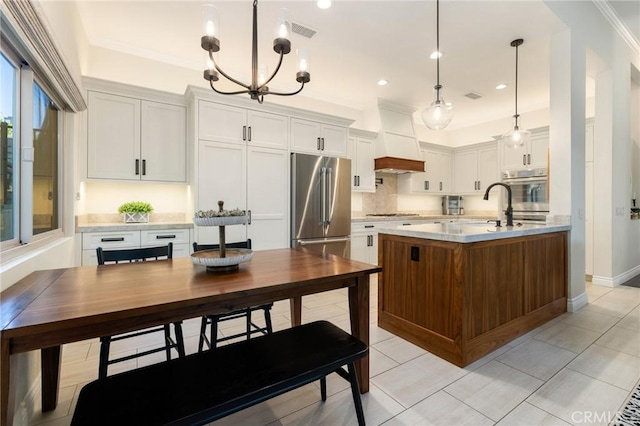 2666 Peacock Pl, La Verne, CA 91750 - kitchen with appliances with stainless steel finishes, light countertops, a chandelier, custom range hood, and crown molding