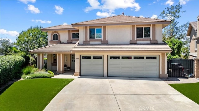 2666 Peacock Pl, La Verne, CA 91750 - view of front of house featuring a garage, concrete driveway, and stucco siding
