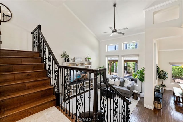 2666 Peacock Pl, La Verne, CA 91750 - stairway featuring ceiling fan, ornamental molding, high vaulted ceiling, and wood finished floors