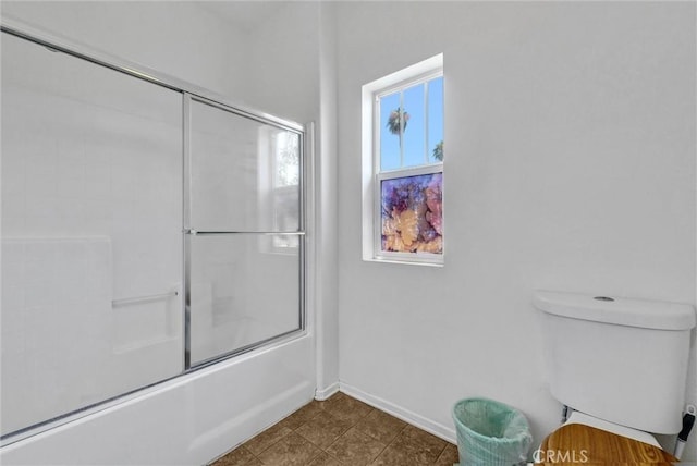 2925 Lemon St, Riverside, CA 92501 - bathroom with bath / shower combo with glass door and baseboards