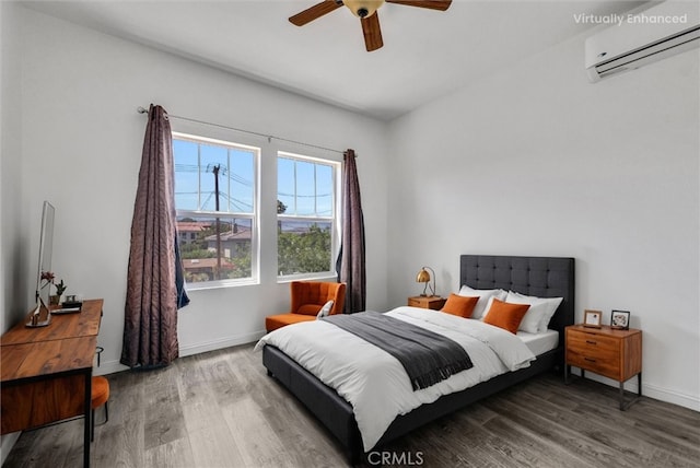 2925 Lemon St, Riverside, CA 92501 - bedroom featuring a wall mounted air conditioner, wood finished floors, and ceiling fan