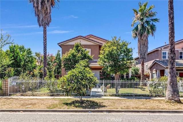 2925 Lemon St, Riverside, CA 92501 - view of property hidden behind natural elements with stucco siding and a fenced front yard