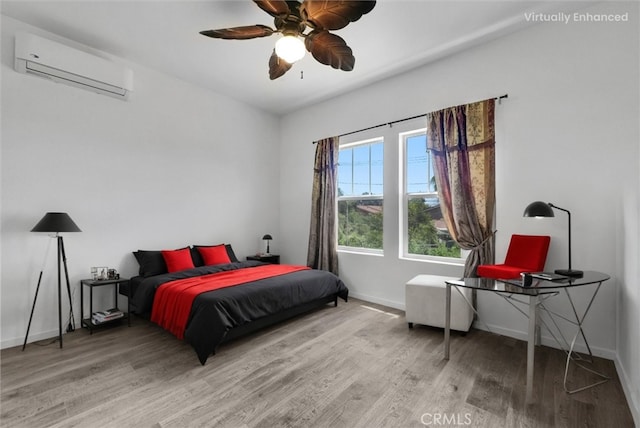 2925 Lemon St, Riverside, CA 92501 - bedroom featuring a wall unit AC, wood finished floors, and a ceiling fan