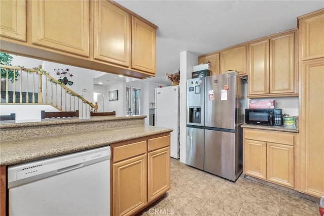 2925 Lemon St, Riverside, CA 92501 - kitchen with white appliances, light brown cabinets, and light countertops
