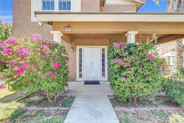 2925 Lemon St, Riverside, CA 92501 - doorway to property with stucco siding and a surveillance system
