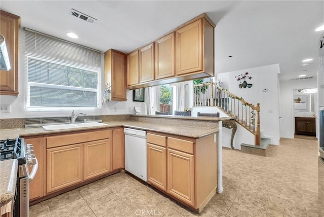 2925 Lemon St, Riverside, CA 92501 - kitchen featuring dishwasher, stainless steel gas range, a peninsula, light countertops, and recessed lighting