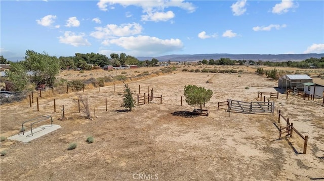8558 W W Ave E8, Lancaster, CA 93536 - view of yard featuring a view of countryside, an outbuilding, and a mountain view