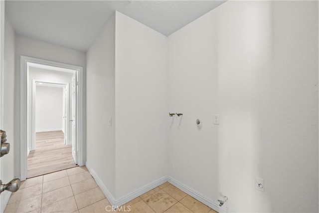 8558 W W Ave E8, Lancaster, CA 93536 - washroom with electric dryer hookup, light tile patterned flooring, and gas dryer hookup