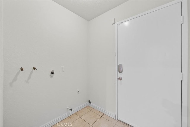 8558 W W Ave E8, Lancaster, CA 93536 - laundry room with hookup for a gas dryer, light tile patterned flooring, and electric dryer hookup